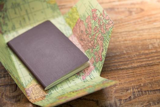 Blank passport with Map on wood table